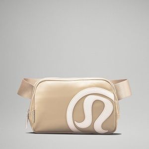 Lululemon Everywhere Belt Bag in trench and white.